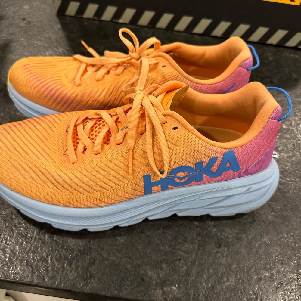 Orange hoka rincon 3 women’s running shoes
